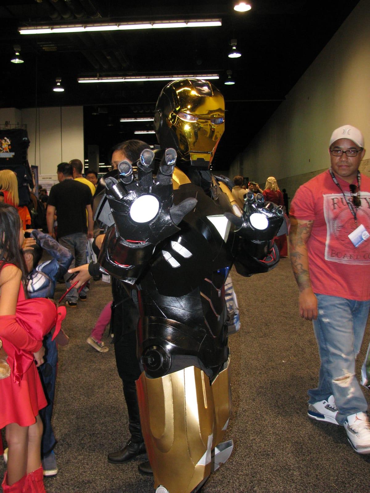 A full-body Iron Man cosplay armor suit with separate shoulder, bicep, forearm and thigh sections visible